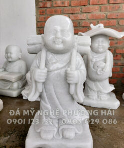 Tượng đá chú tiểu gánh củi